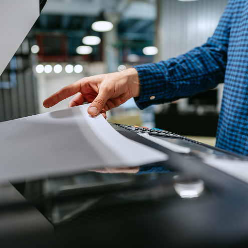 employees looking at document management software